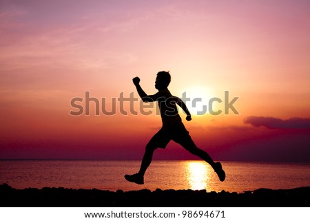 The Silhouette of runner on the beach