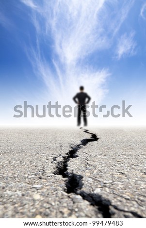 businessman stand on the crack road