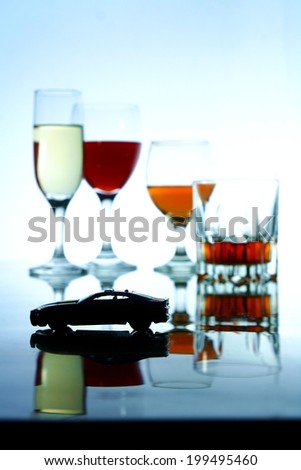 Alcoholic Drink and a toy car Photo of an alcoholic drink in a crystal glass and a toy car