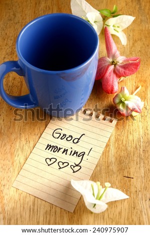 coffee mug with lipstick mark and a note saying good morning