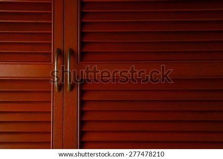 Wooden cabinet door with metal handle