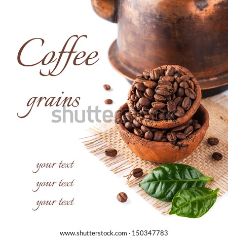 Coffee grains and green leaves on a white background with sample text