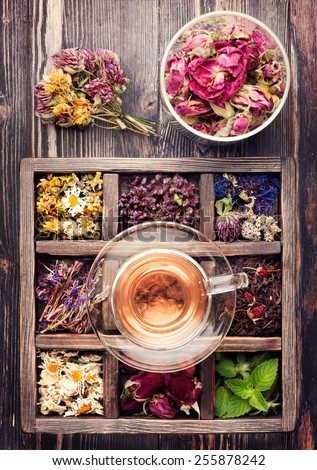 Herbal tea, dried flowers and dried herbs in a vintage box. top view