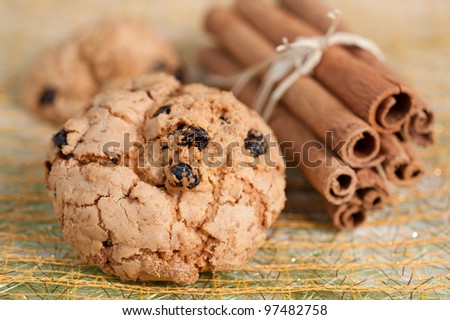 Homemade cookies with raisins and cinnamon sticks