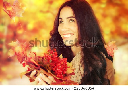 Autumn woman on autumn leafs background.