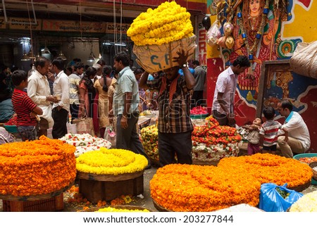 BANGALORE, INDIA - June 06: Flower sellers at KR Market in Bangalore. June 06, 2014 in Bangalore, India.