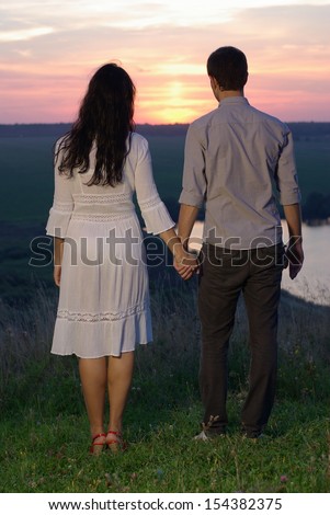 Sweethearts looking at the sunset