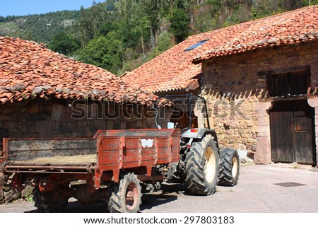 Typical old village of  Spain. Old tractor on the old street.