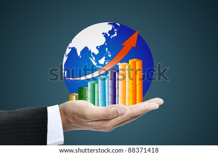 business hand holding a globe with increasing graph