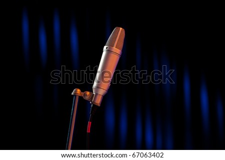microphone on stage with blue and black background