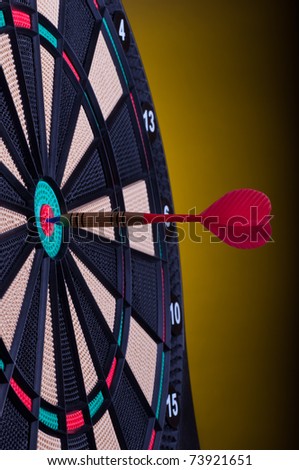 close up of an electronic dart board and red arrow