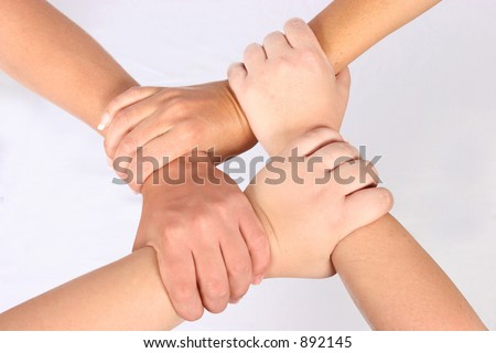 Interlocked hands of four people