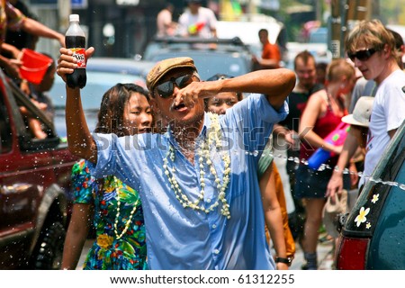 CHIANG MAI, THAILAND - APRIL 13: Thai old man gets fun on April 13, 2010 in Chiang Mai, Thailand. Celebration of Thai New Year (Songkran water festival)  in 2010.