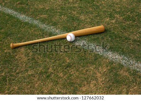 Baseball & Bat on the grass with room for copy