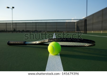 Tennis Ball and Racquet on the Court