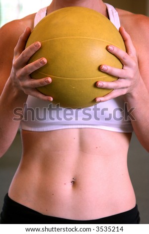 Fit woman holding a medicine ball