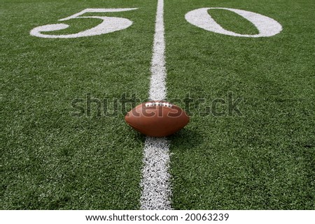 American football near the fifty yard line