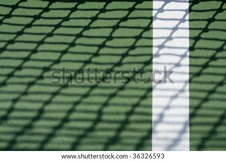 Tennis court with the shadow of the net