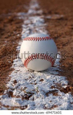 Baseball centered on an infield chalk line