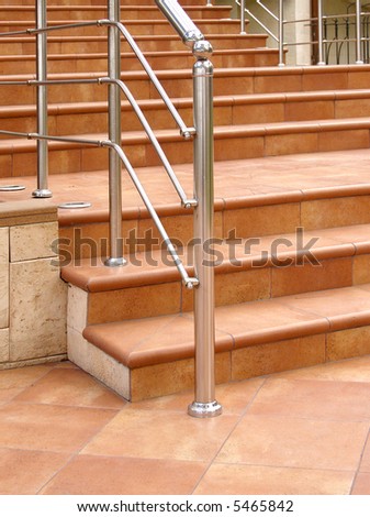 Front staircase with steel railing.