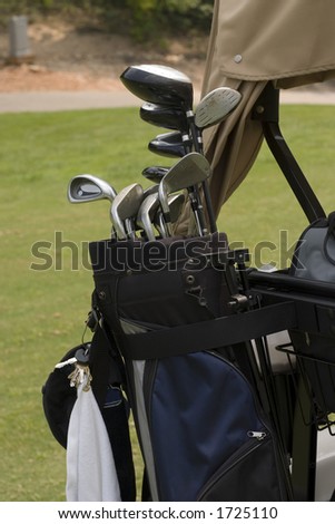 Golf bag on back of cart with essentials for playing the game