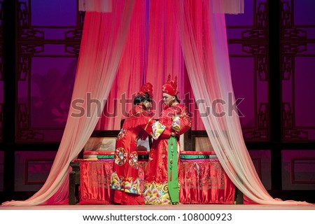 CHENGDU - JUN 3: chinese Yue opera performer make a show on stage to compete for awards in 25th Chinese Drama Plum Blossom Award competition at Experimental theater.Jun 3, 2011 in Chengdu, China.