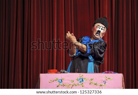 CHENGDU - JUNE 5: chinese traditional mime actor performs on stage at Chongzhou theater.Jun 5, 2011 in Chengdu, China.