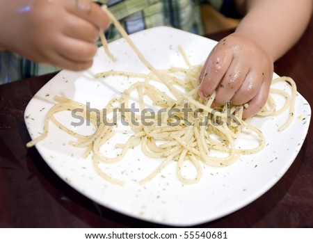 eating baby to grab pasta