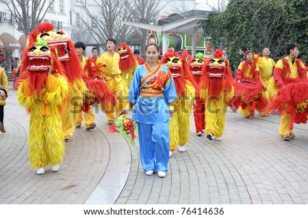 CHENGDU - FEB 3: People playing lion dances to celebrate festivals during chinese new year on Feb 3, 2011 in Chengdu, China. Lion dances during festivals are part of the traditional custom in China.