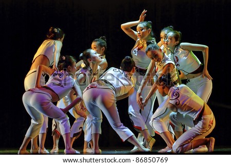 CHENGDU - DEC 14: Chinese dancers perform modern group dance on stage at Golden theater in the 7th national dance competition of china on Dec 14,2007 in Chengdu, China.
