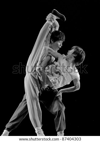 CHENGDU - DEC 12: modern dancers perform duo dance on stage at JINCHENG theater in the 7th national dance competition of china on Dec 12,2007 in Chengdu, China.