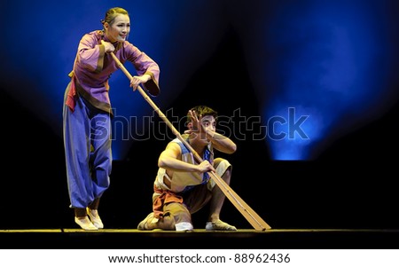 CHENGDU - DEC 13: chinese dancers perform duo dance on stage at JINCHENG theater.Dec 13,2007 in Chengdu, China. Choreographer: Fu Xiaoqing, actor: Yan Yan, Wang Fei
