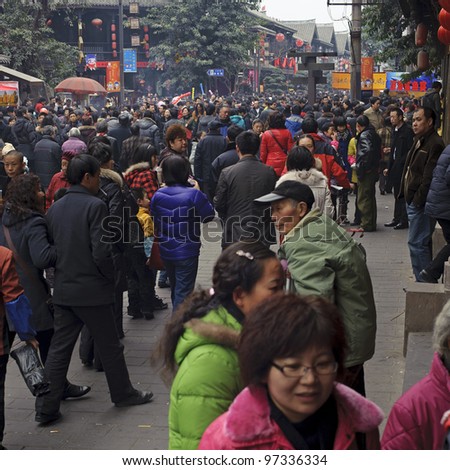 CHENGDU - FEB 14: crowded People waiting to enter a temple to pray to Buddha during chinese new year on Feb 14, 2010 in Chengdu, China. It\'s part of the important traditional custom in China.