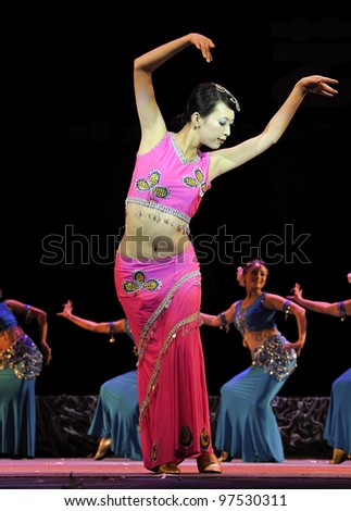 CHENGDU - SEP 28: chinese Dai ethnic dancer performs on stage in the 6th Sichuan minority nationality culture festival at JINJIANG theater.Sep 28,2010 in Chengdu, China.