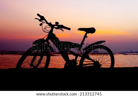 Mountain bike silhouette with sunset sky, Thailand