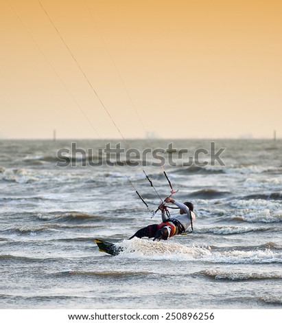 CHONBURI, THAILAND - FEBRUARY 7 : Sportman play kite surf on Fabruary 7, 2014 in Bangsean, Chonburi, Thailand