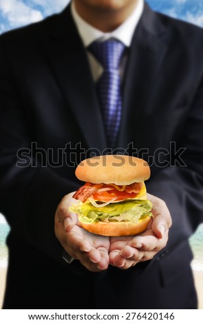 Businessman share food (Hamburger), Share food concept
