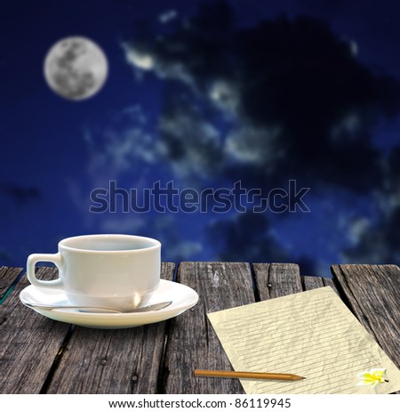 Hot coffee and letter paper for write mail with night sky