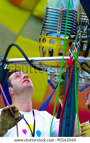 CHAING MAI, THAILAND - NOV 25 : Unidentified man to prepare the faucet gas of balloon on Nov 25, 2011 at Prince Royal's College in Chiang Mai, Thailand International Balloon Festival 2011