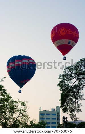 CHIANG MAI, THAILAND - NOV 27 : Balloon floating to sky over city during Thailand international balloon festival 2011 at Prince Royal\'s college in Chiang Mai, Thailand on Nov 27, 2011.
