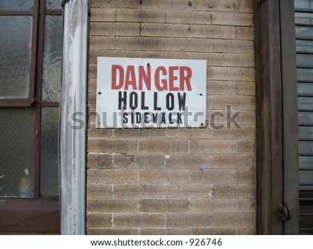 danger hollow sidewalk sign