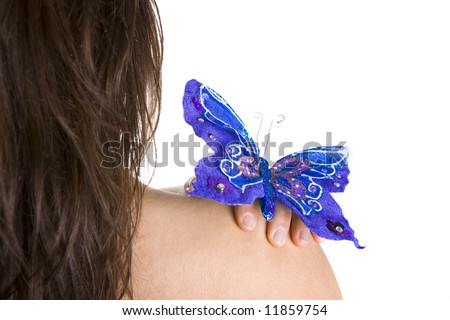blue butterfly resting on woman naked shoulder