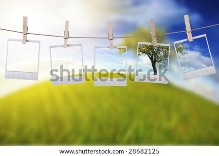 disposable photos frames hanging in the rope on a beautiful summer day - landscape orientation