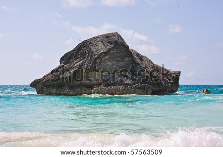 A large rock in the atlantic ocean in the coastal waters of Bermuda. Photo was taken at Horseshoe Bay in Bermuda.