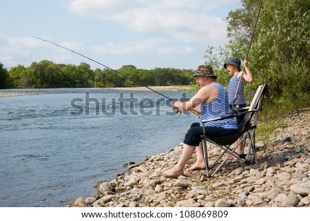 Grandfather and grandson go fishing on weekends.