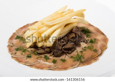 Pickled beef tongue with mushrooms and fried potato straws.