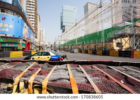 MACAU, CHINA - NOVEMBER 2, 2012: Safety barriers installed along roads before the upcoming racing Macau Grand Prix in stages Formula 3, FIA WTCC, motorcycle prize. Race takes place on the streets.