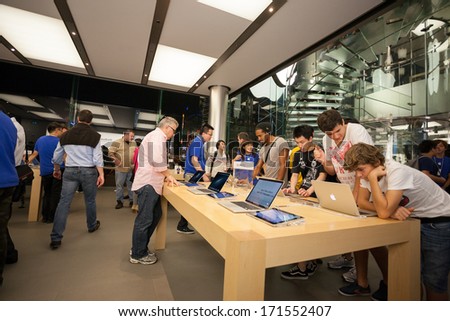HONG KONG, CHINA - NOVEMBER 11, 2012: Buyers and shop assistants at Apple store in Hong Kong. Store is in a shopping center IFC Mall, it is very popular with locals and tourists visiting Hong Kong.