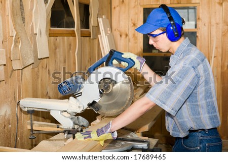 A carpenter(sawman) at work.