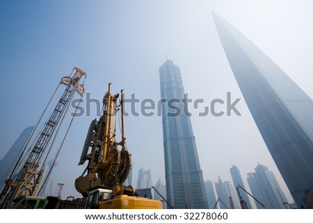 Lujiazui financial & Trade Zone in Shanghai. China.In the foreground the beginning of construction of new office building. June, 2009.